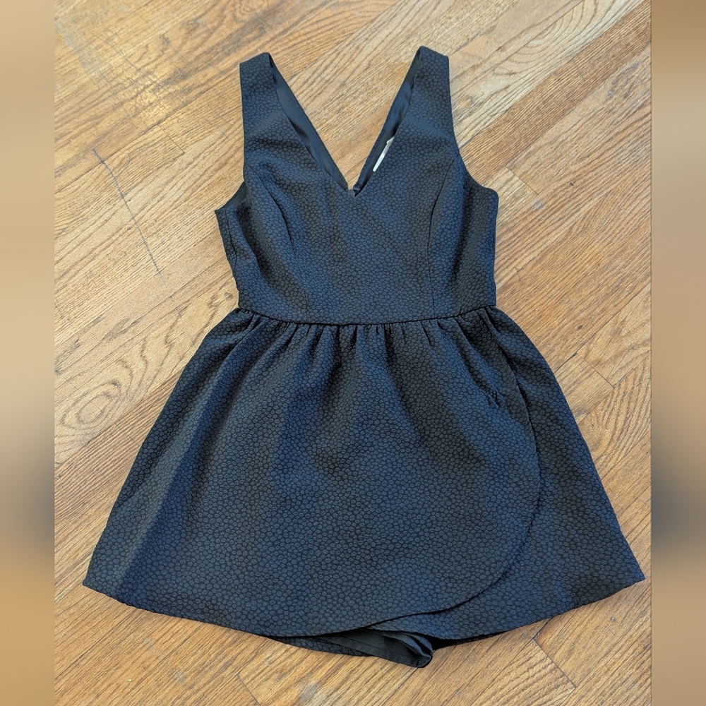Elegant Black Sleeveless Romper with Tulip Skirt